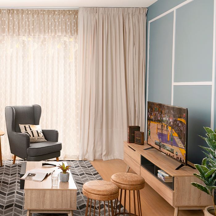 Living room lit by a warm floor lamp