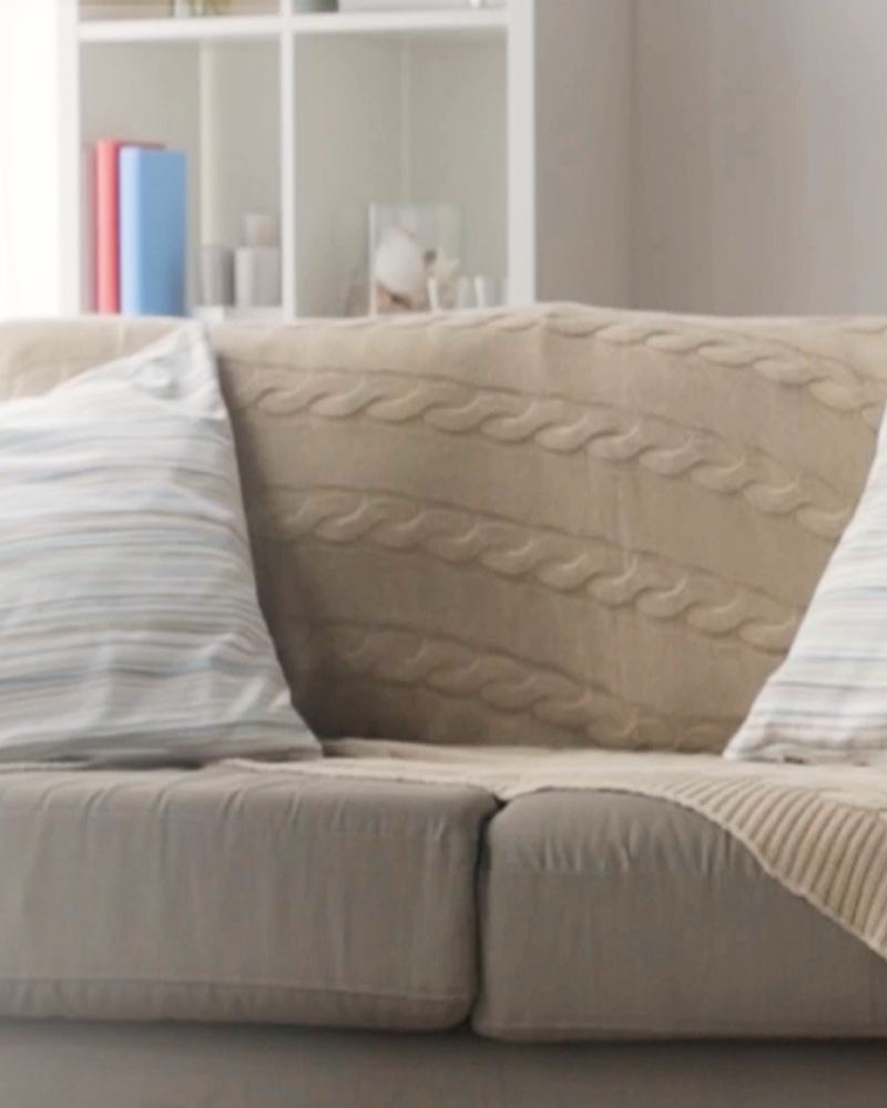 Mid-century corner with a grey sofa and side table