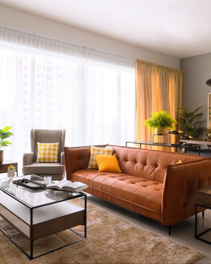 Rustic living space with an orange leather sofa