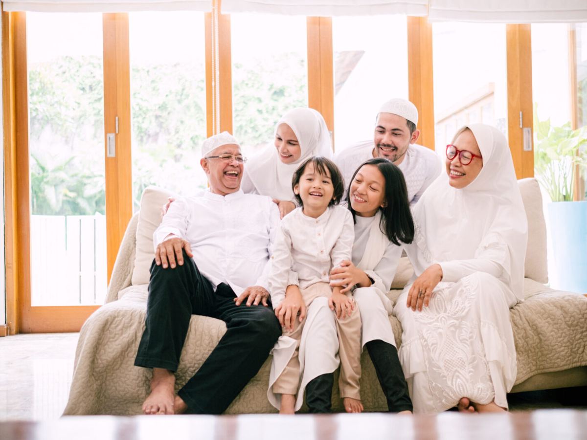 A family gathered together at home during a festive celebration