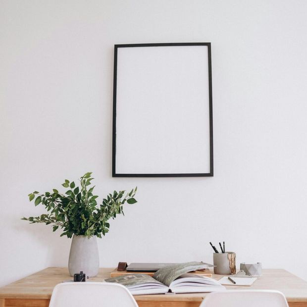 Framed wall art above a console table